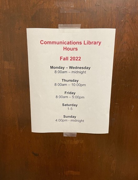 A sign on a door Description automatically generated