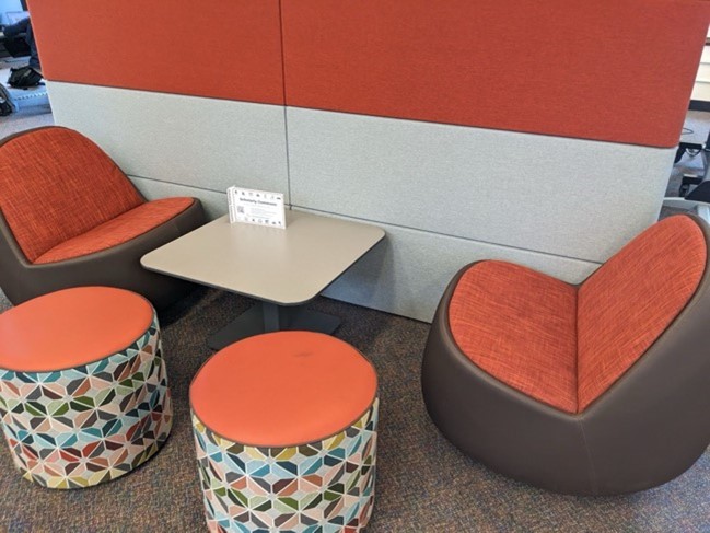 A group of chairs and a table Description automatically generated