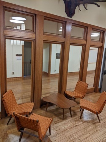 A group of chairs in a room Description automatically generated